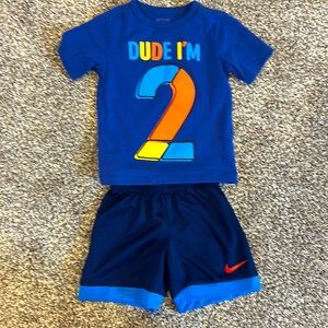 Nike shorts and “2” shirt